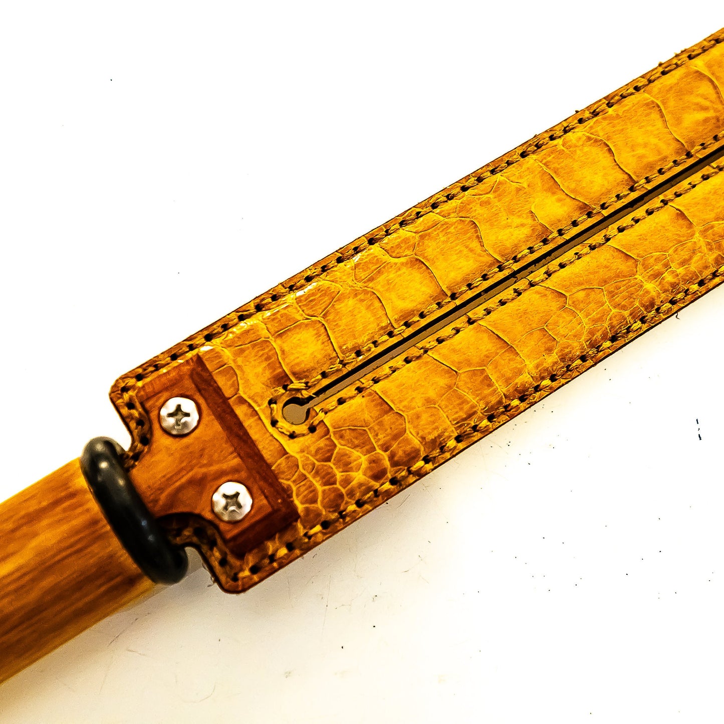 Tawse/Ostrich/Light Amber. 51cm/20", double-tongued paddle made of layered leather with carbon inlay
