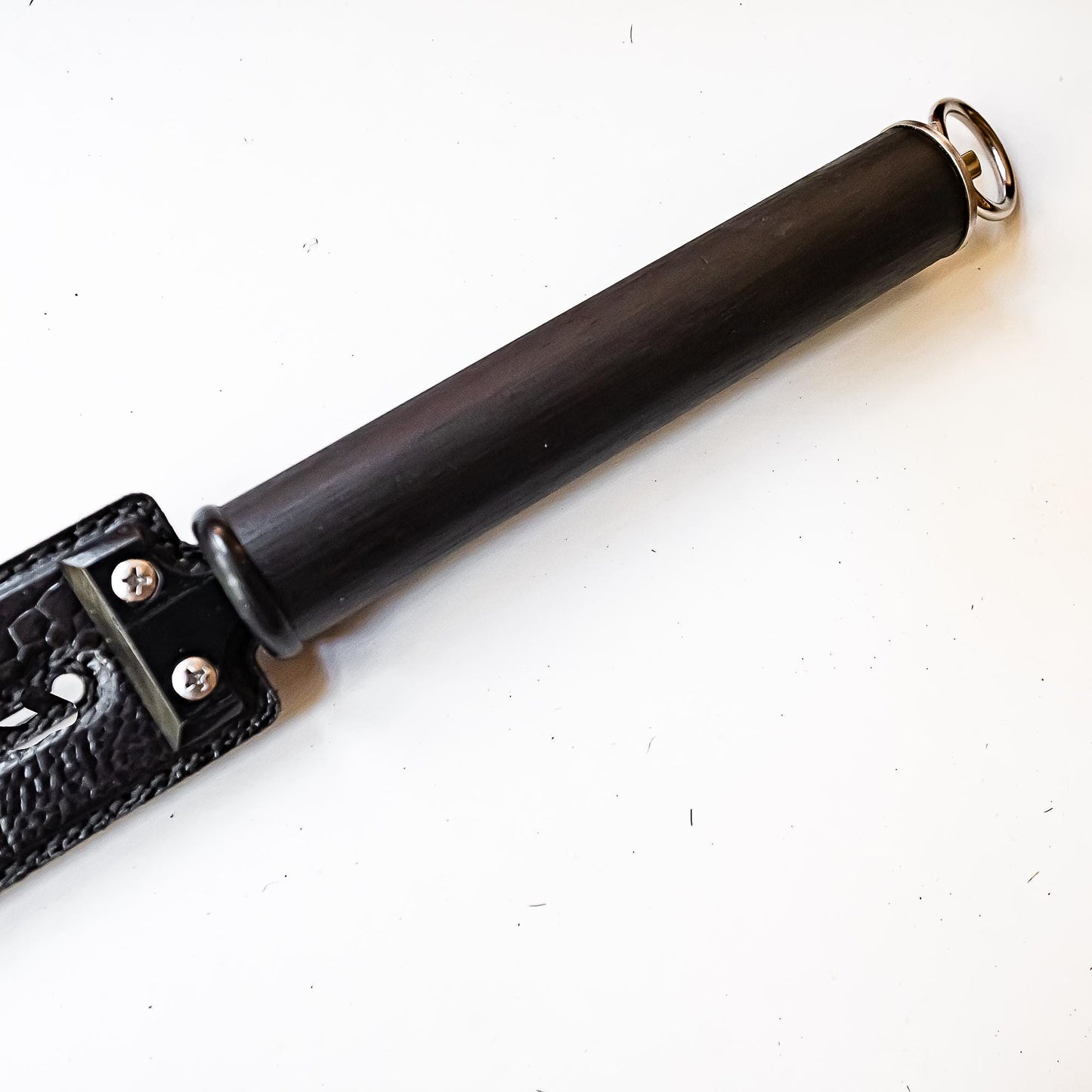 Tawse/Ostrich/Black. 51cm/20", double-tongued paddle made of layered leather with carbon inlay