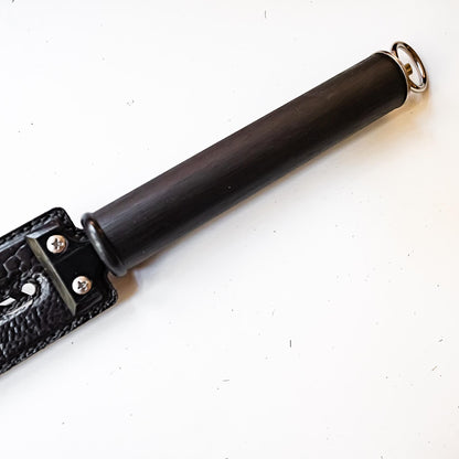 Tawse/Ostrich/Black. 51cm/20", double-tongued paddle made of layered leather with carbon inlay