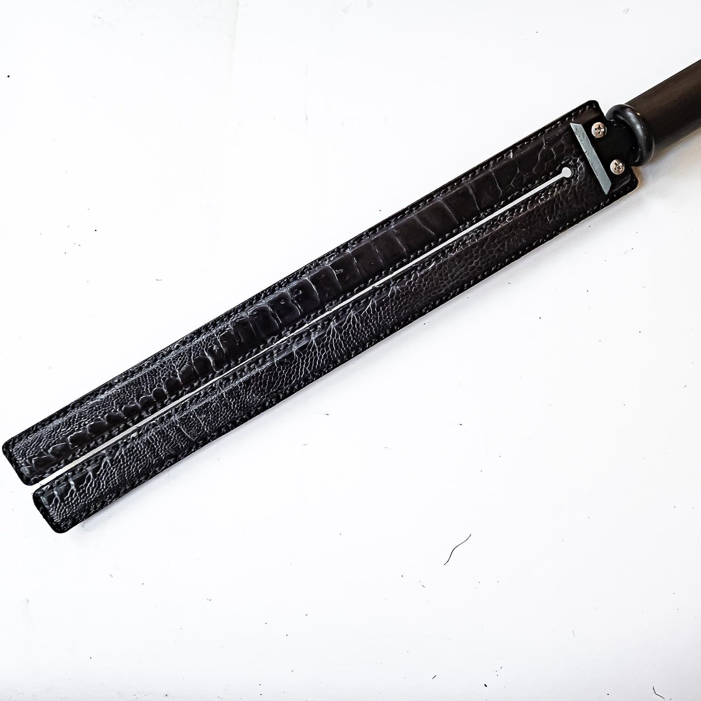 Tawse/Ostrich/Black. 51cm/20", double-tongued paddle made of layered leather with carbon inlay