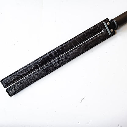 Tawse/Ostrich/Black. 51cm/20", double-tongued paddle made of layered leather with carbon inlay